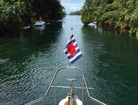 bow of a boat in inland waterway with cps-ecp flag
