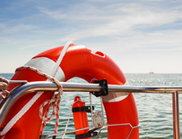 A lifesaving ring on the side of a boat